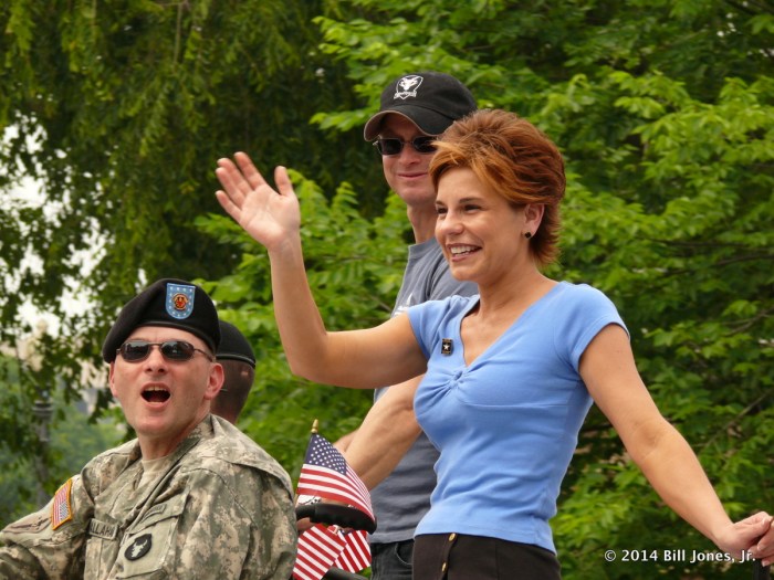 Her smile, after losing a leg in a war she didn't start, is warmer than yours ...