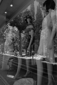 This photographic composition uses 'natural' features of the urban landscape in order to create an optical illusion where the reflected image in the window overlays the mannequins. Our perception of what is considered real and is altered.